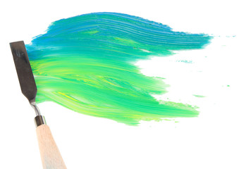 Painting palette knife with paint isolated on white