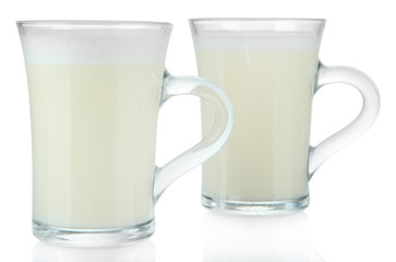 Cups of eggnog isolated on white