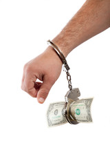 hand handcuffed to a one dollar banknote isolated