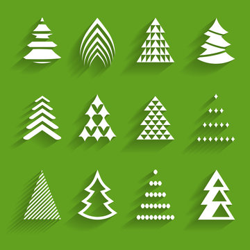 set of stylized paper fir trees on the green background