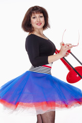 Young Female Musician with Red Trombone Dancing