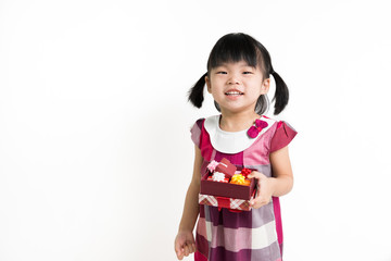 Little Asian child with gift box