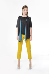 Full length Portrait of beautiful young woman walking in studio