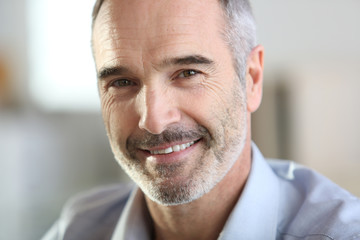 Closeup of handsome senior man with grey hair