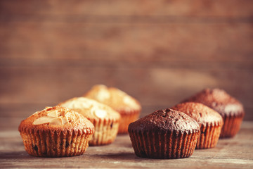 Muffin on wooden table.