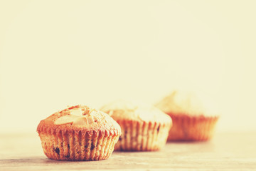 Muffin on wooden table.