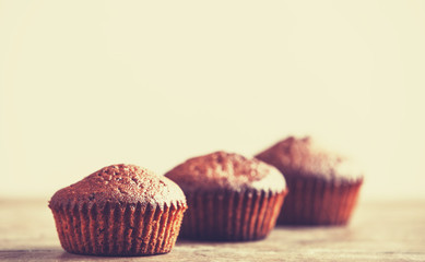 Muffin on wooden table.
