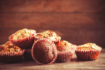 Muffin on wooden table.