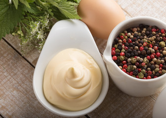 Mayonnaise in bowl on table