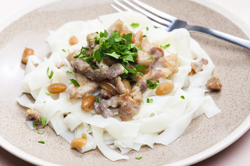 chicken, beef and pork meat with peanuts and rice noodles