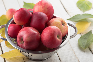 Fresh apples in metallic bowl