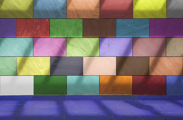 Wall made of colored tiles with slanted shadows