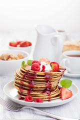 pancakes with berry and jam for breakfast