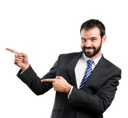 Businessman pointing to the side over white background