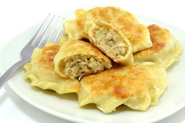fried dumplings filled with meat and cabbage
