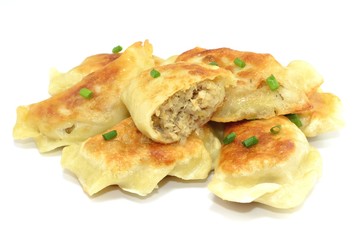 fried dumplings filled with meat and cabbage