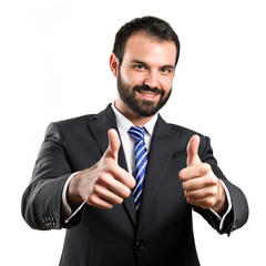 Young businessman getting OK over white background