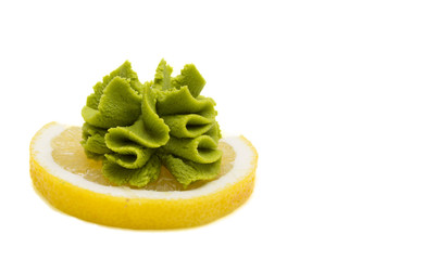 Wasabi on lemon isolated on white background