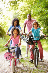 African American Family On Cycle Ride In Countryside