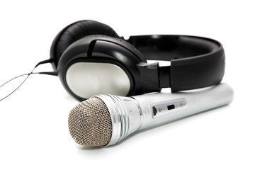 Microphone and ear-phones on a white background