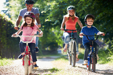 Family On Cycle Ride In Countryside