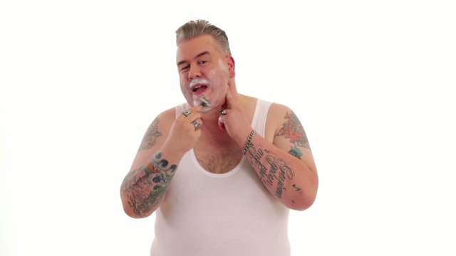 tattooed man shaves off
