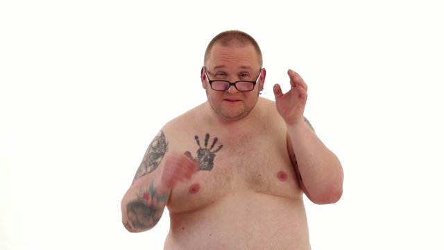 tattooed man styles himself 