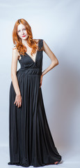 redhead full body in black dress,studio shot