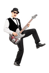 Euphoric man playing a bass guitar