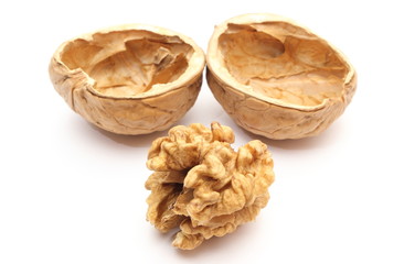 Walnut without shell and nutshell on white background