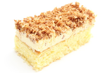 Sponge cake with cream and coconut. White background