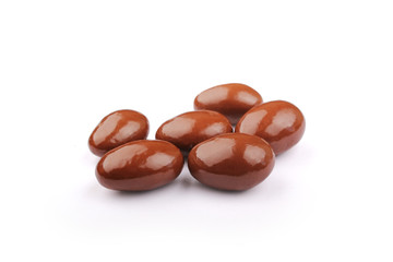 Dark brown dragee, in chocolate covered