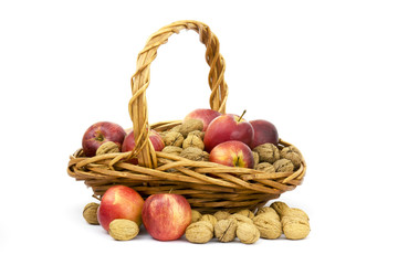 basket full of whole walnuts and apples