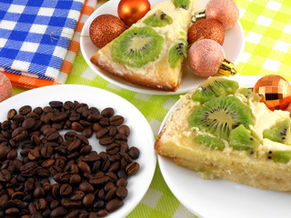 Christmas decoration with coffee beans and sweet kiwi cake