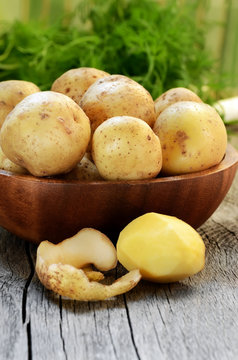 Raw potatoes in bowl