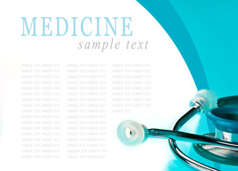 Stethoscope on blue, reflective background