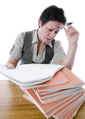 frustrated teacher marking students work on desk