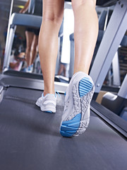 Fototapeta na wymiar legs on treadmill