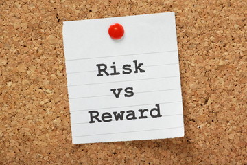 Risk Versus Reward Cork Notice board concept