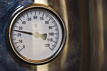 temperature gauge with a shiny metallic frame