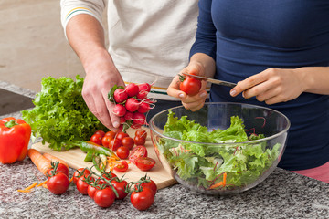 Preparing a salad with fresh vegetables