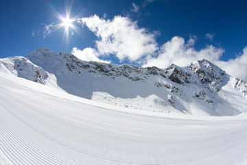 perfectly groomed empty ski piste