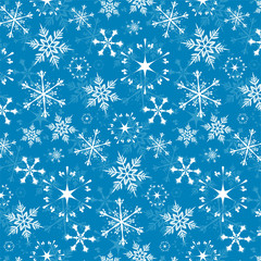 Seamless vector pattern - white snowflakes on blue background
