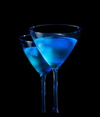 glasses of  fresh cocktail with ice on black background