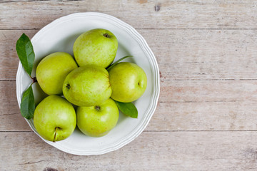 fresh green apples in plate