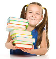 Little girl with books