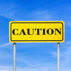 Caution written on road sign