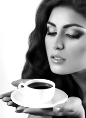 Beautiful woman with coffee cup. Fashion portrait