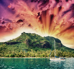 Wonderful dream island in Polynesia with small boat and Ocean