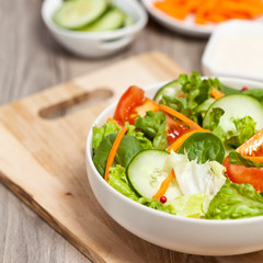 Green salad with tomato, cucumber and carrots